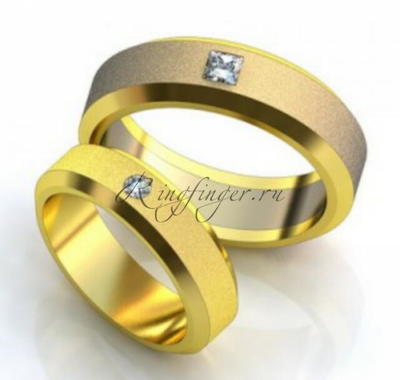 Обручальное кольцо классического типа с четко выраженными гранями и бриллиантом
